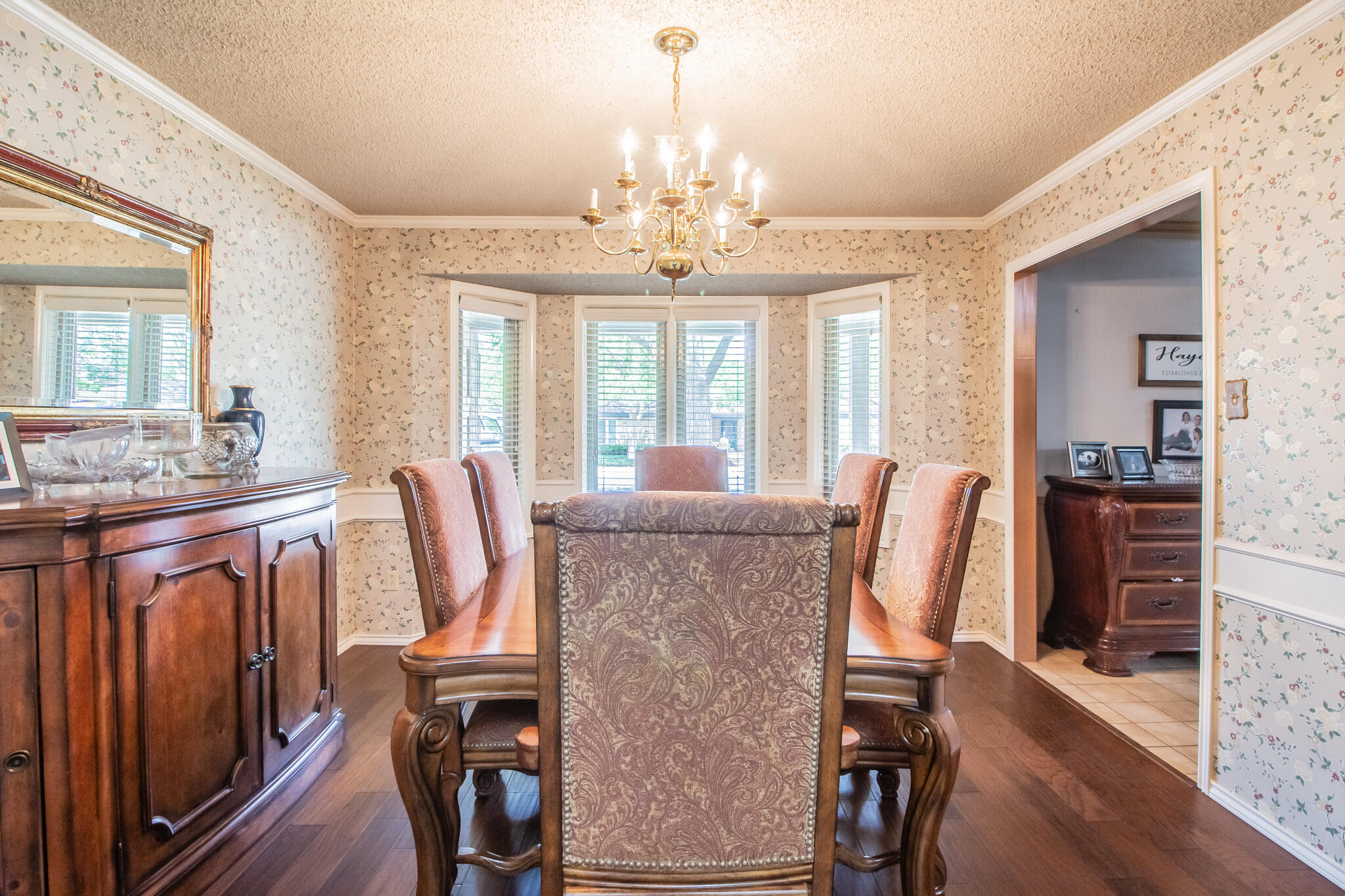 4213 88th Place Lubbock, TX 79423 - Photo 16 of 40 a view of a dining room with furniture window and wooden floor