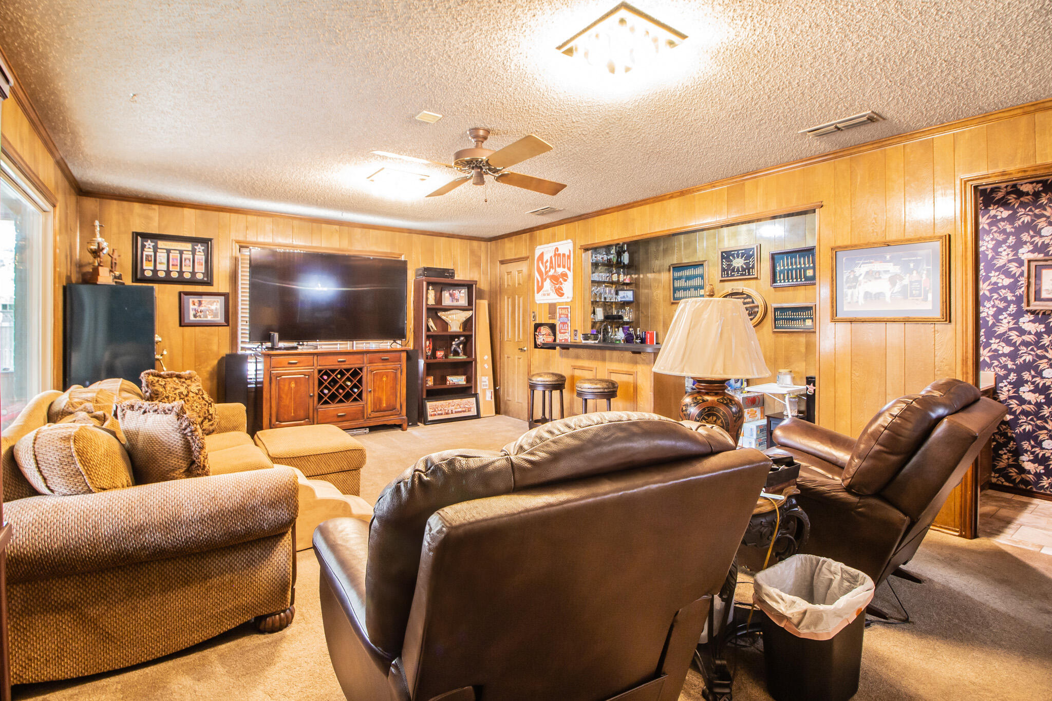 4213 88th Place Lubbock, TX 79423 - Photo 18 of 40 a bedroom with furniture and a flat screen tv