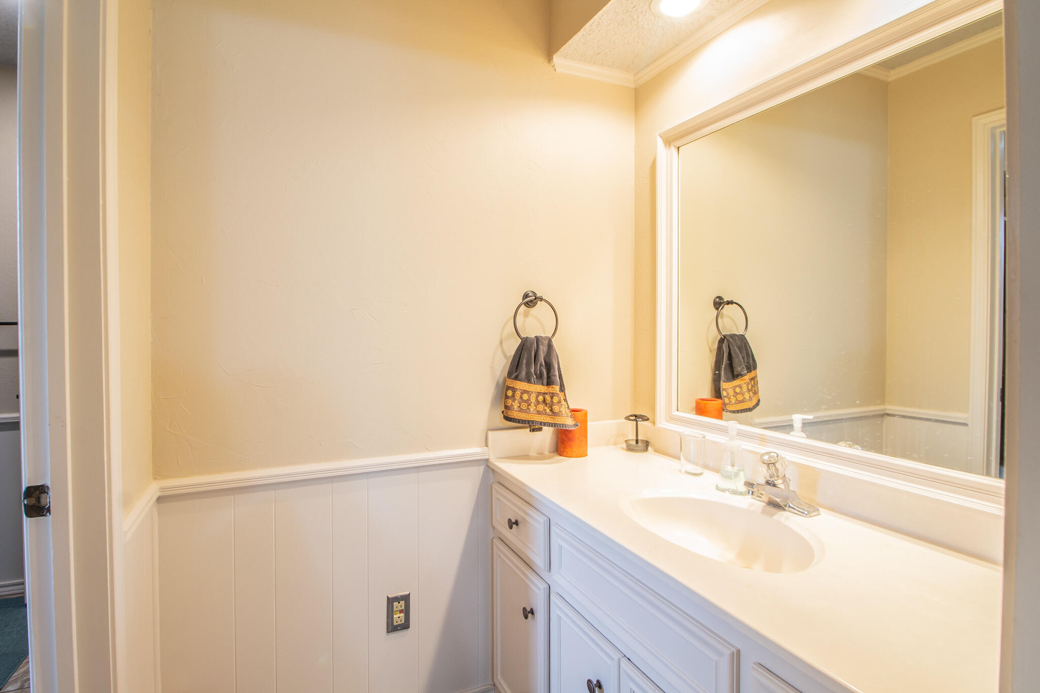 4213 88th Place Lubbock, TX 79423 - Photo 31 of 40 a bathroom with a sink and a mirror