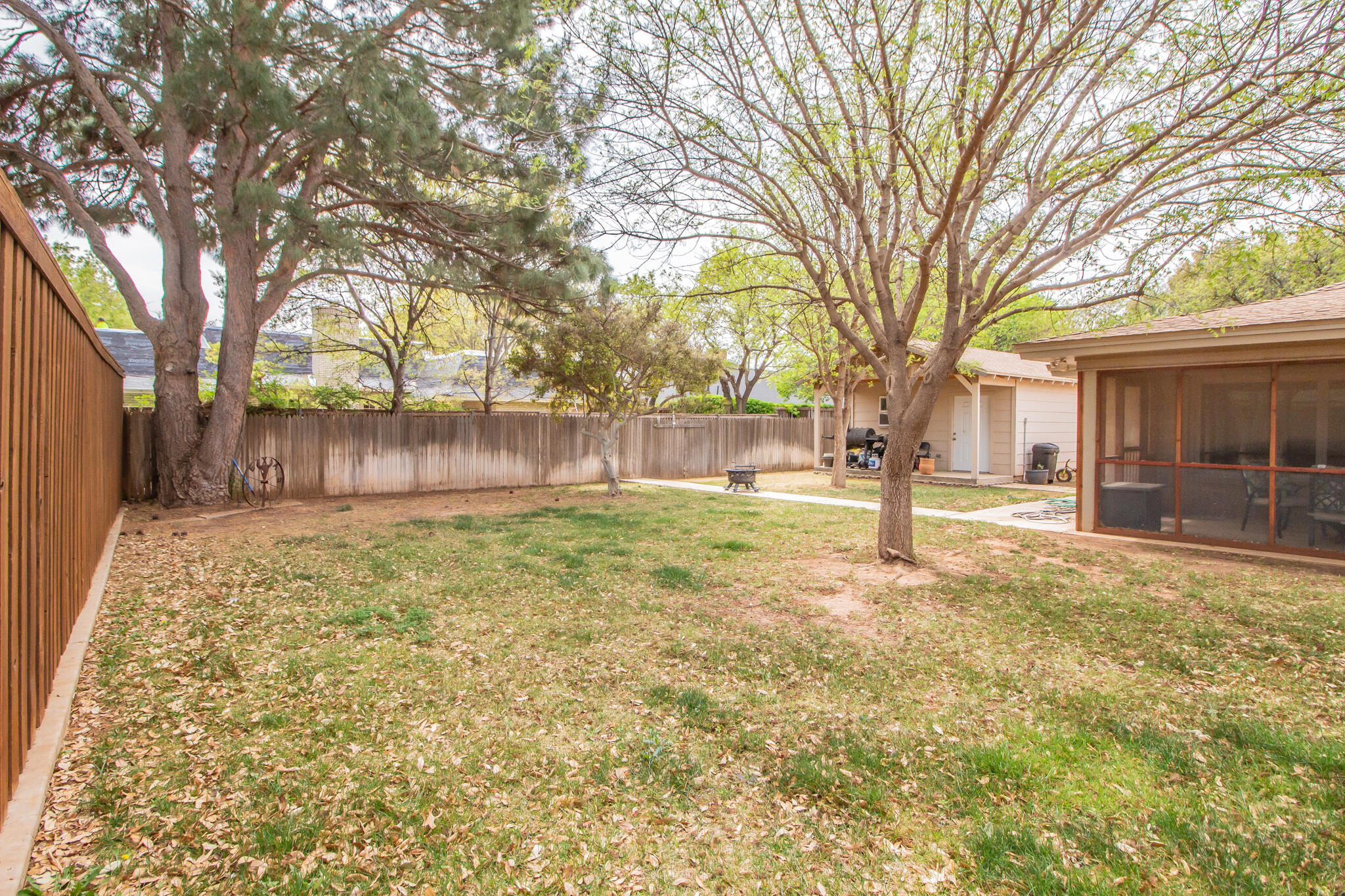 4213 88th Place Lubbock, TX 79423 - Photo 37 of 40 a view of a yard with a house and large tree
