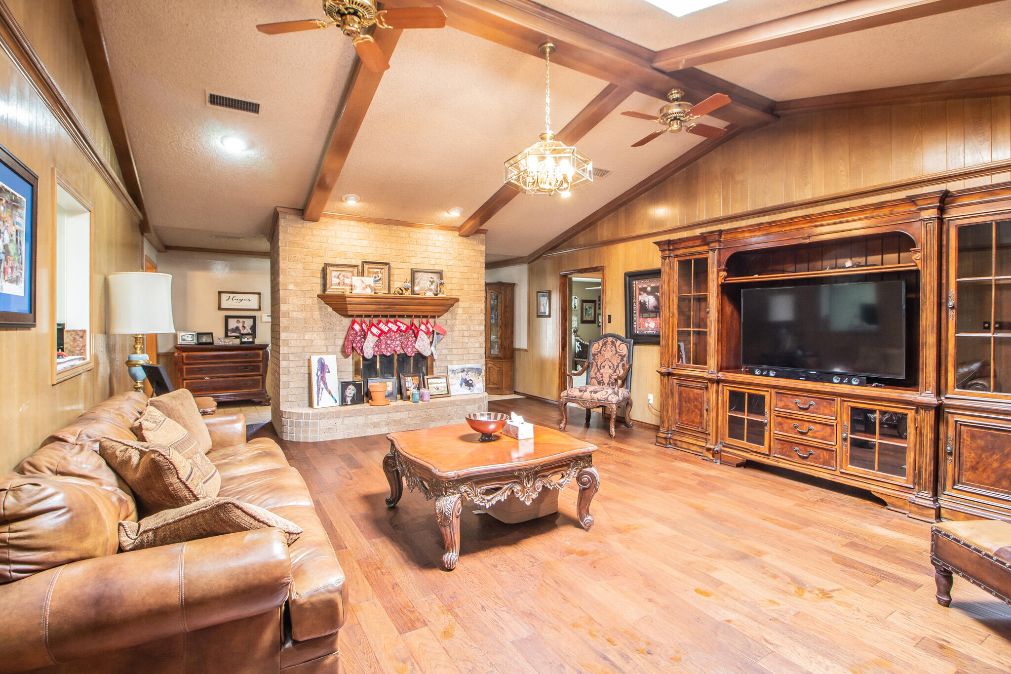 4213 88th Place Lubbock, TX 79423 - Photo 8 of 40 a living room with furniture and a flat screen tv