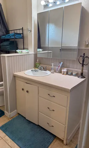 a utility room with a sink washer and dryer