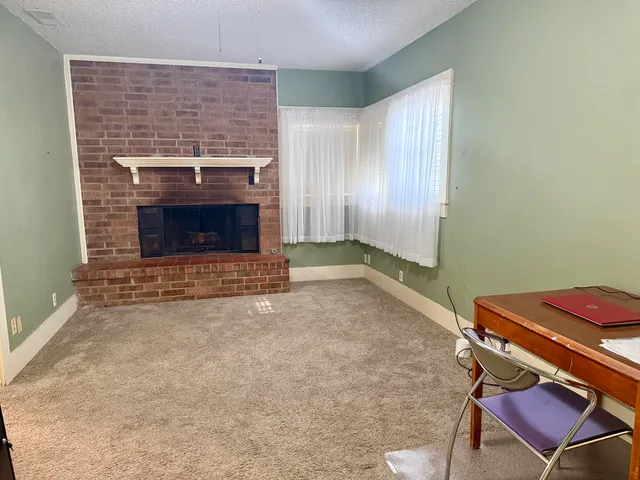 a living room with a fireplace