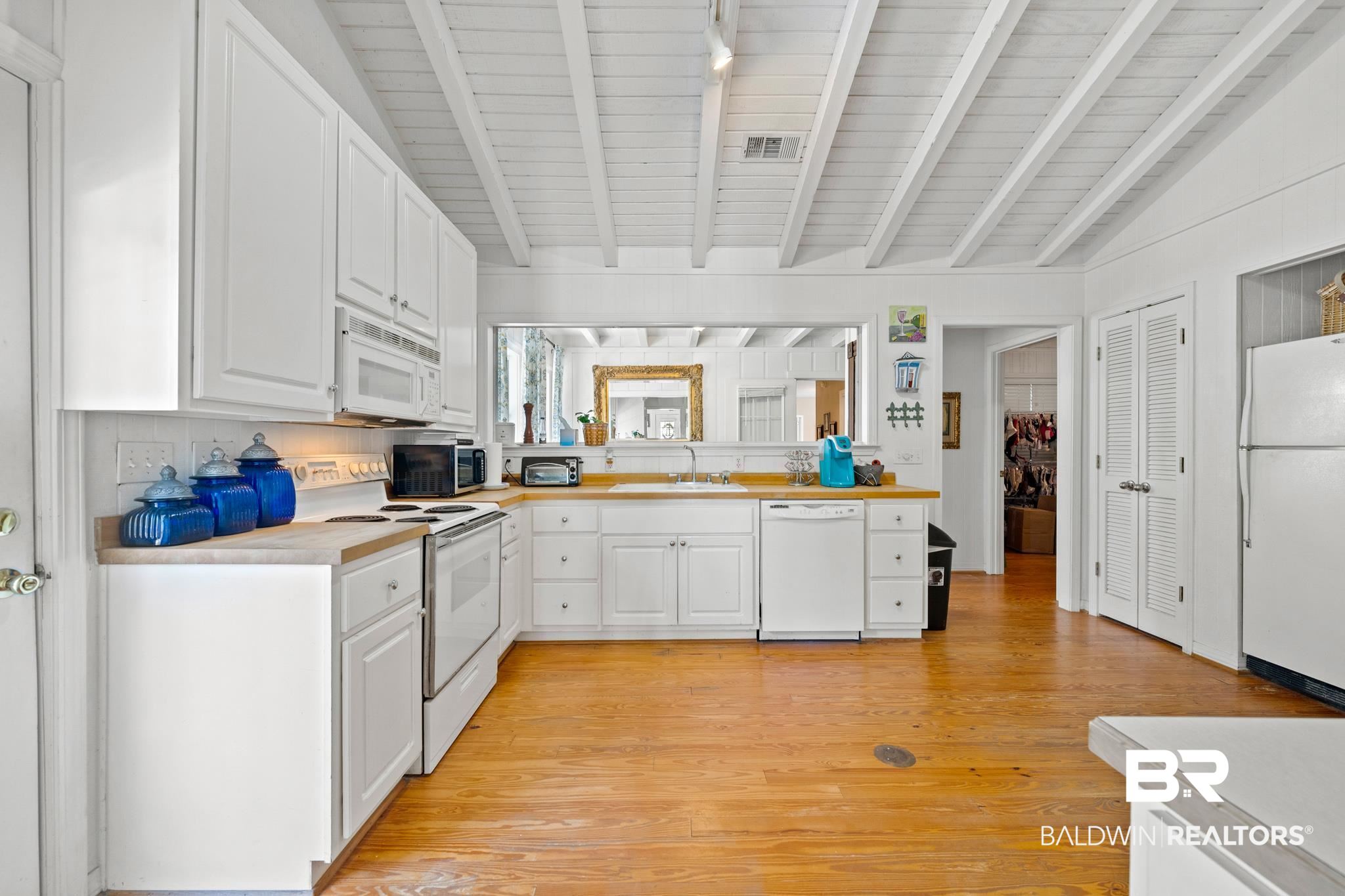 5424 Greentree Road Orange Beach, AL 36561 - Photo 11 of 33 Plenty of Cabinet Space and W/D area