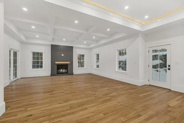 a view of a kitchen with cabinets and wooden floor
