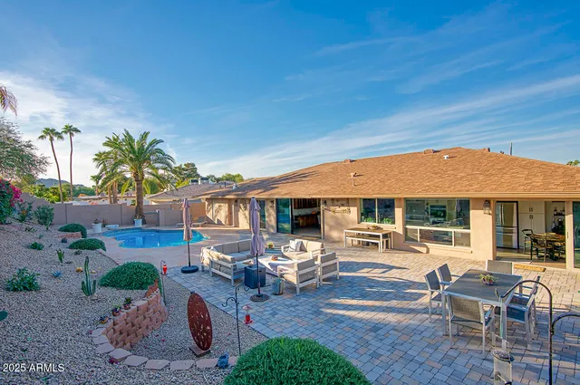 an outdoor space with patio furniture