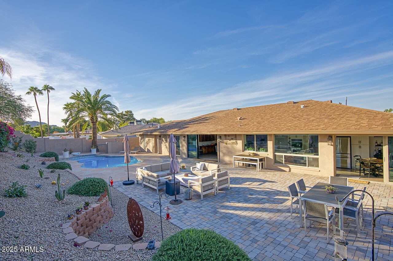 an outdoor space with patio furniture
