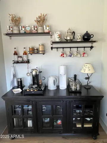 a kitchen with a cabinets and wooden floor
