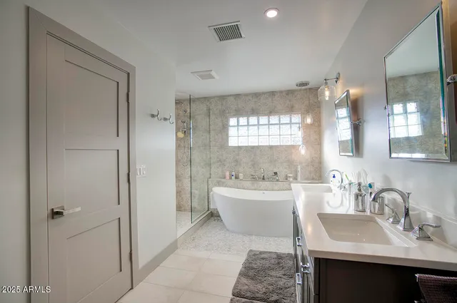 a bathroom with a sink toilet tub and shower