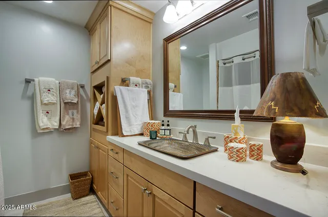 a bathroom with a sink and a mirror