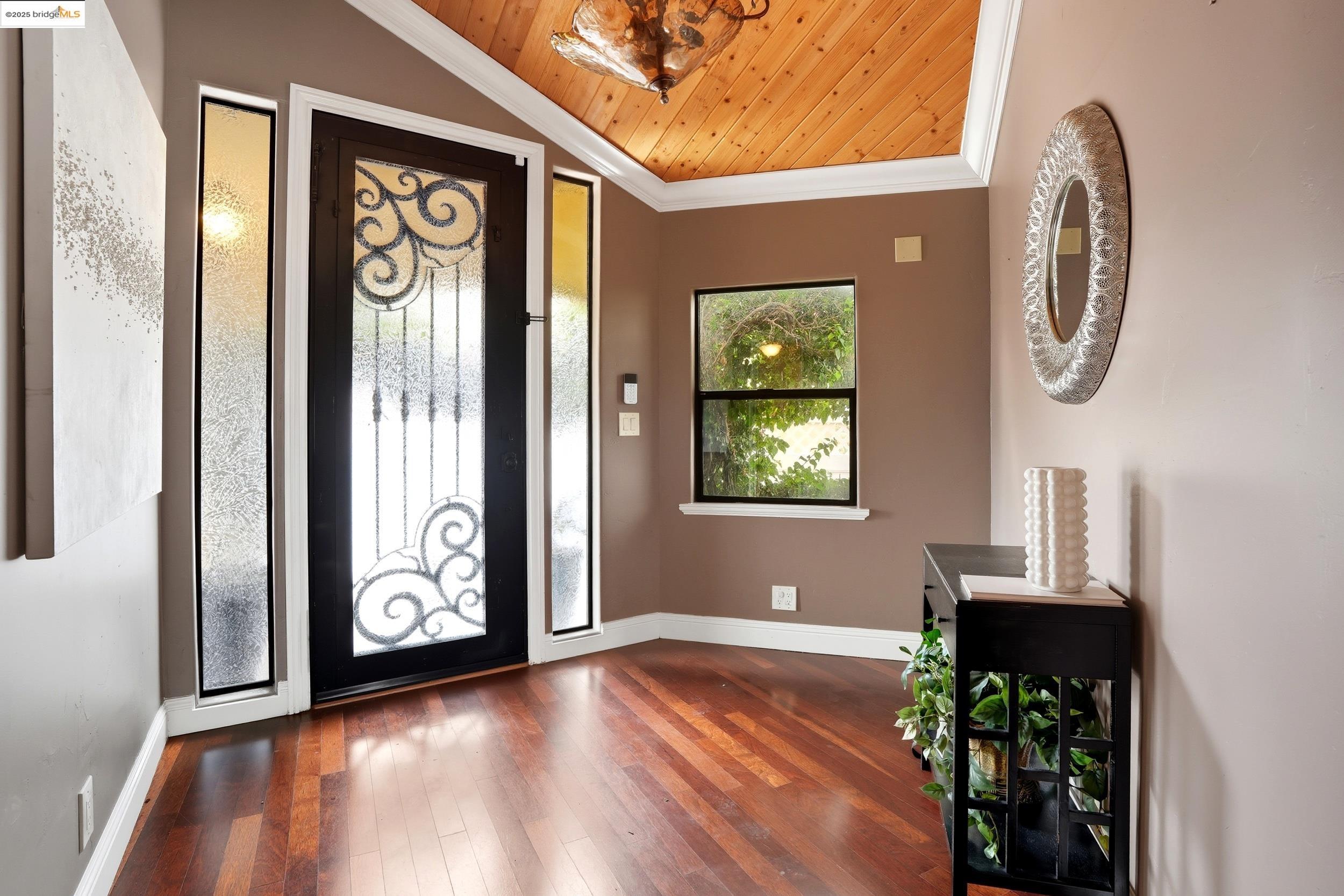 4814 S Point Discovery Bay, CA 94505 - Photo 14 of 52 an empty room with wooden floor and windows