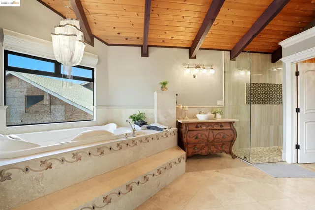 a spacious bathroom with a double vanity sink and a mirror