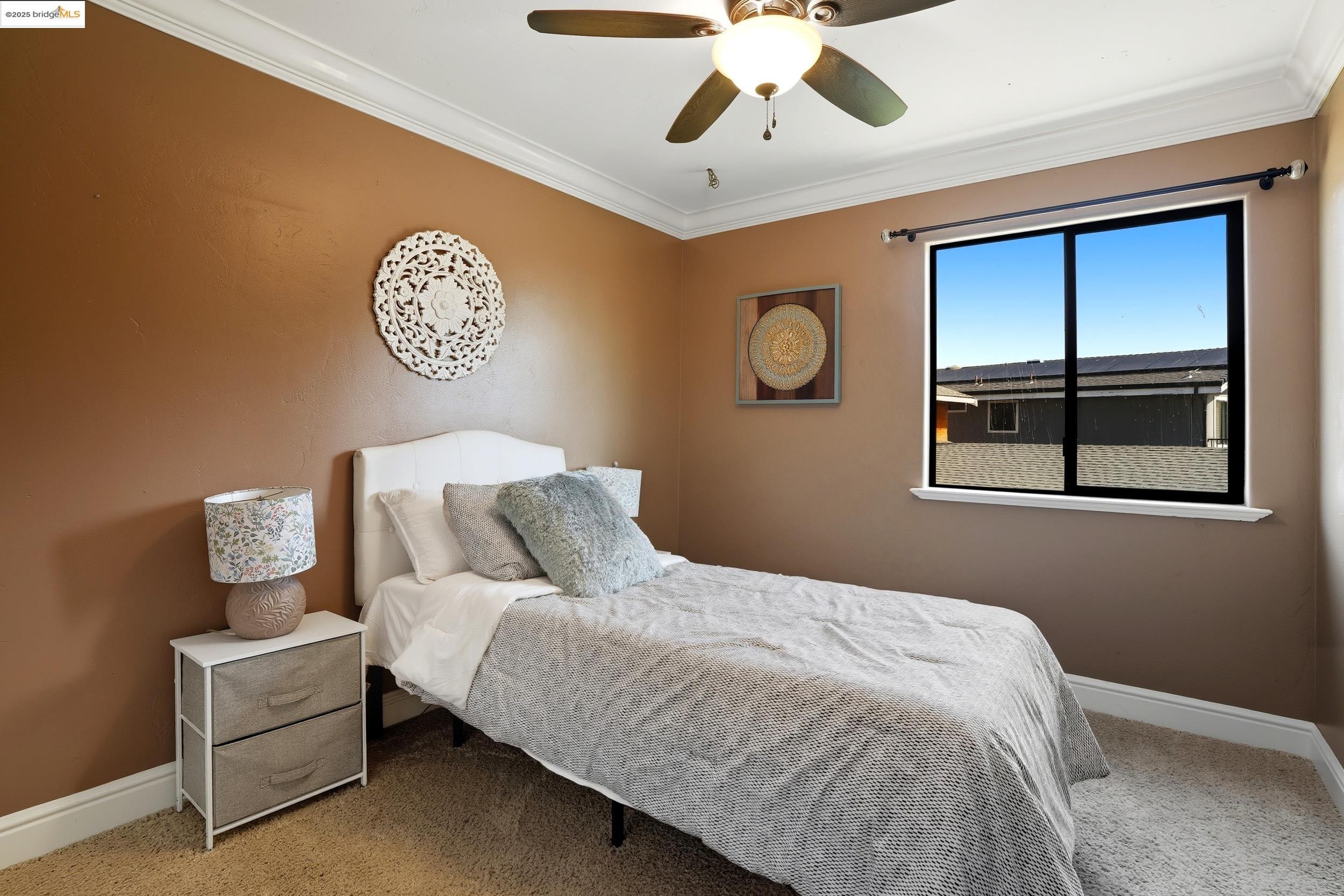 4814 S Point Discovery Bay, CA 94505 - Photo 40 of 52 a bedroom with a bed and a chandelier