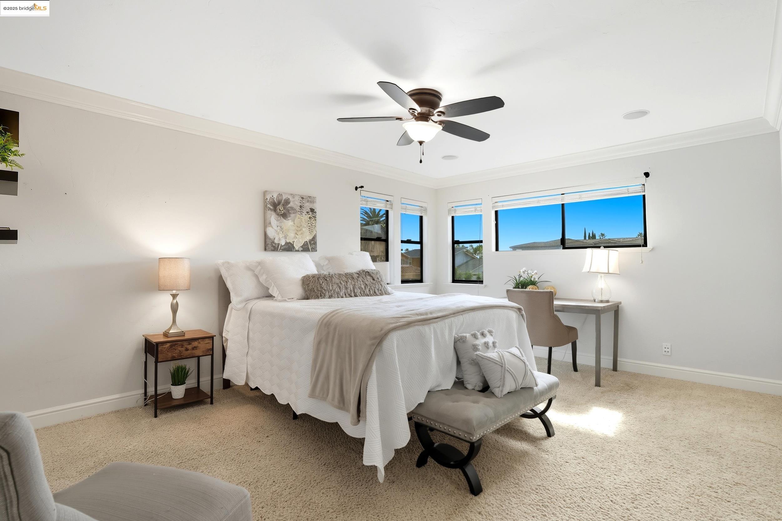 4814 S Point Discovery Bay, CA 94505 - Photo 42 of 52 a spacious bedroom with a bed and a chandelier