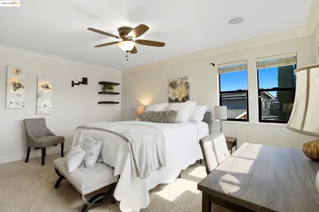 a bedroom with a bed and a chair