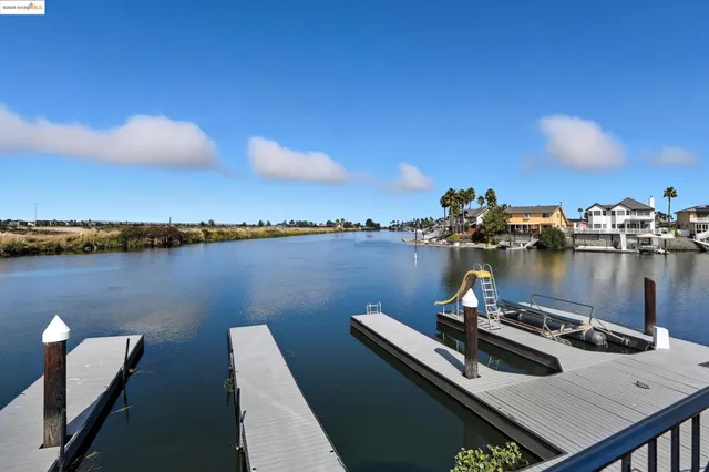 a view of roof deck with outdoor seating and city view