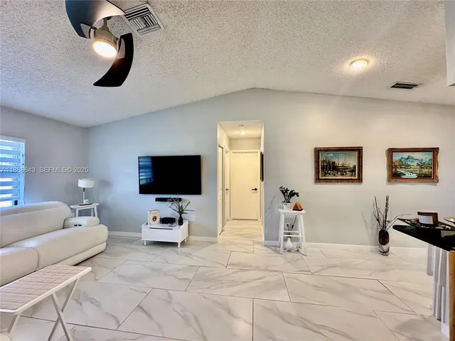 a bedroom with furniture and window