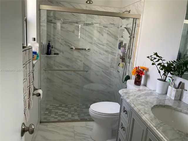 a bedroom with a bed and a chair