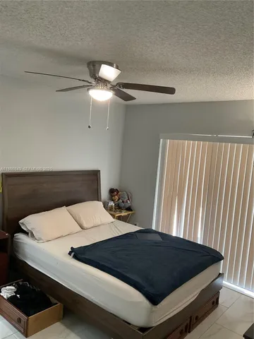 a view of house with backyard and patio