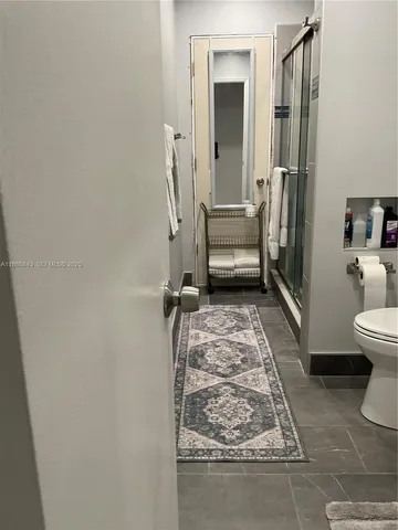 a view of a backyard with potted plants