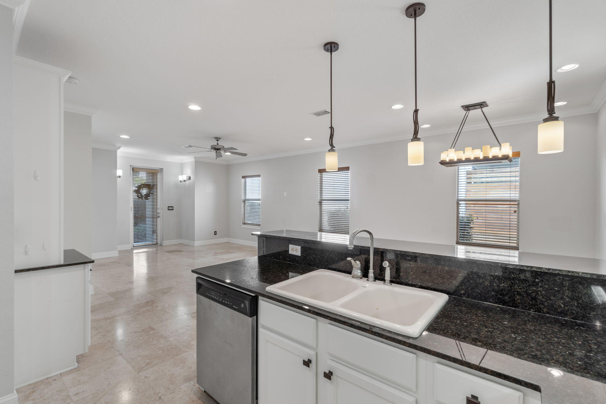 4739 Amhurst Circle Destin, FL 32541 - Photo 12 of 37 a view of a kitchen with a sink and chandelier