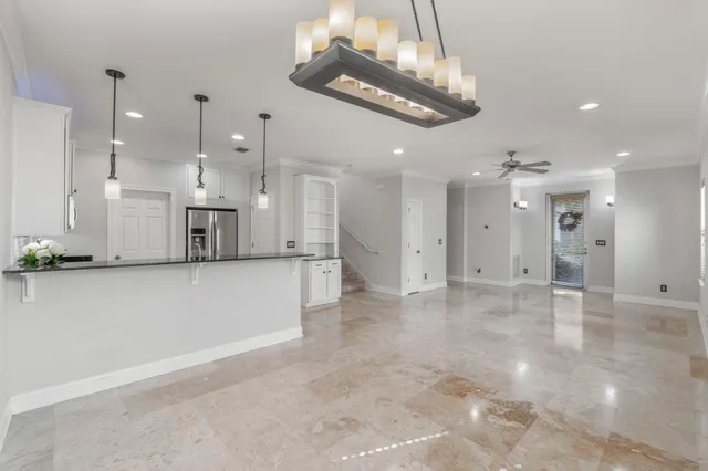 a view of a kitchen with a stove cabinets