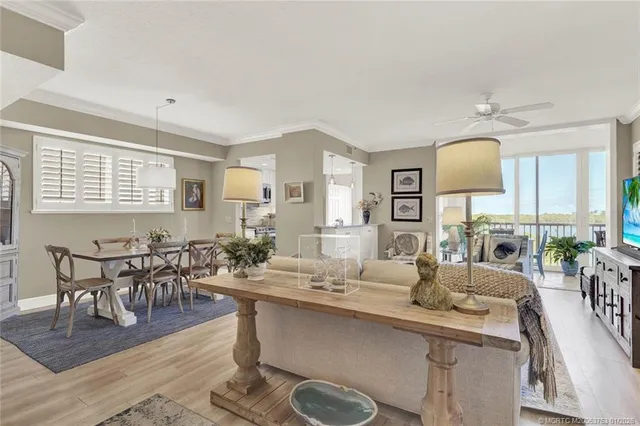 a kitchen with stainless steel appliances granite countertop a sink refrigerator and microwave