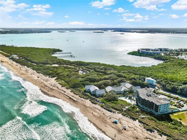 a bathroom with a toilet sink vanity and mirror