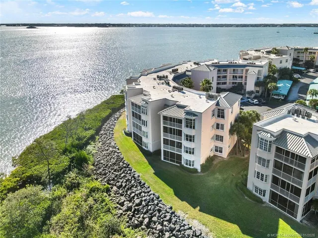 a view of a street with a flower garden