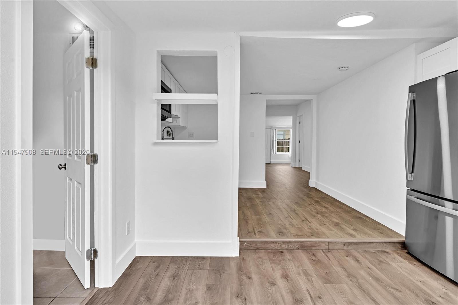 2636 Southwest 29th Court Miami, FL 33133 - Photo 20 of 33 a view of a hallway view with wooden floor and cabinets