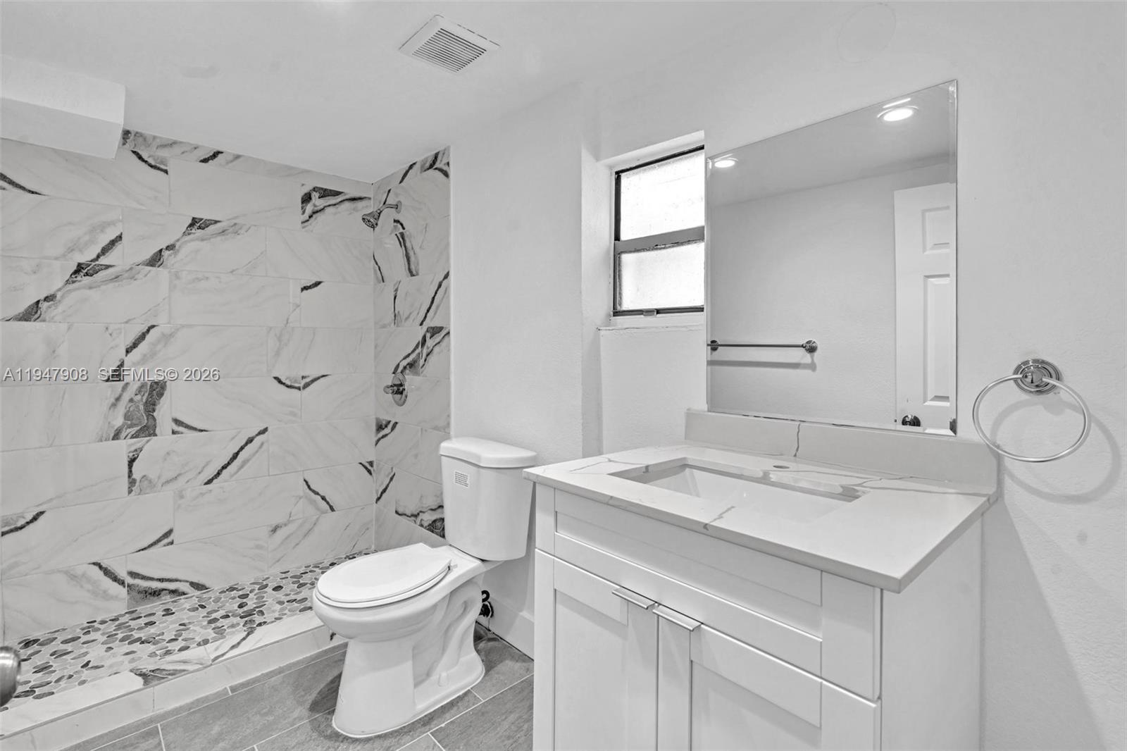 2636 Southwest 29th Court Miami, FL 33133 - Photo 21 of 33 a bathroom with a sink toilet and shower