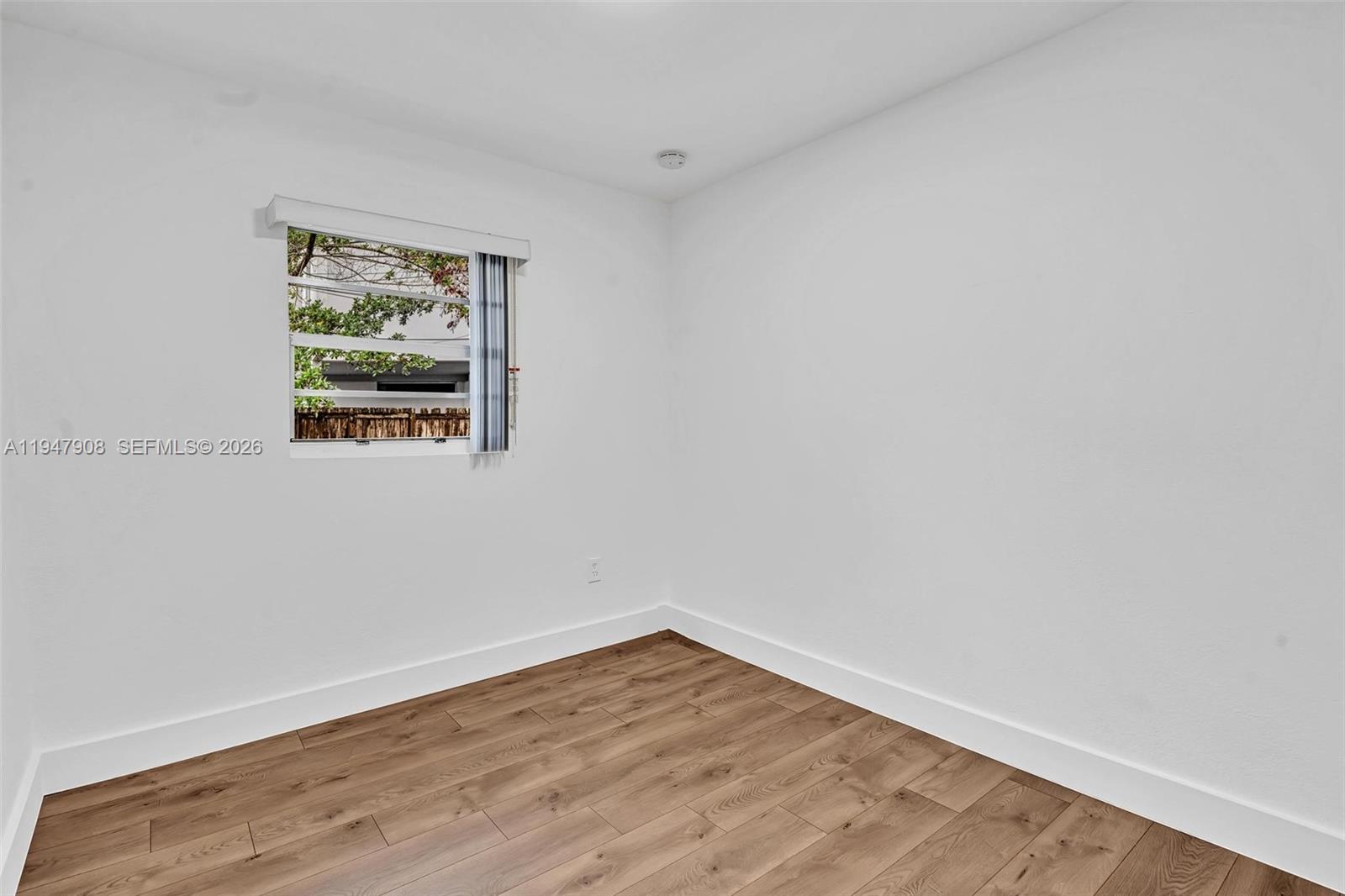 2636 Southwest 29th Court Miami, FL 33133 - Photo 23 of 33 a view of a small space with wooden floor and a window