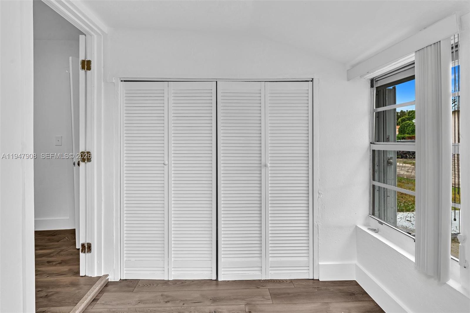 2636 Southwest 29th Court Miami, FL 33133 - Photo 26 of 33 a view of a small space with closet and a window