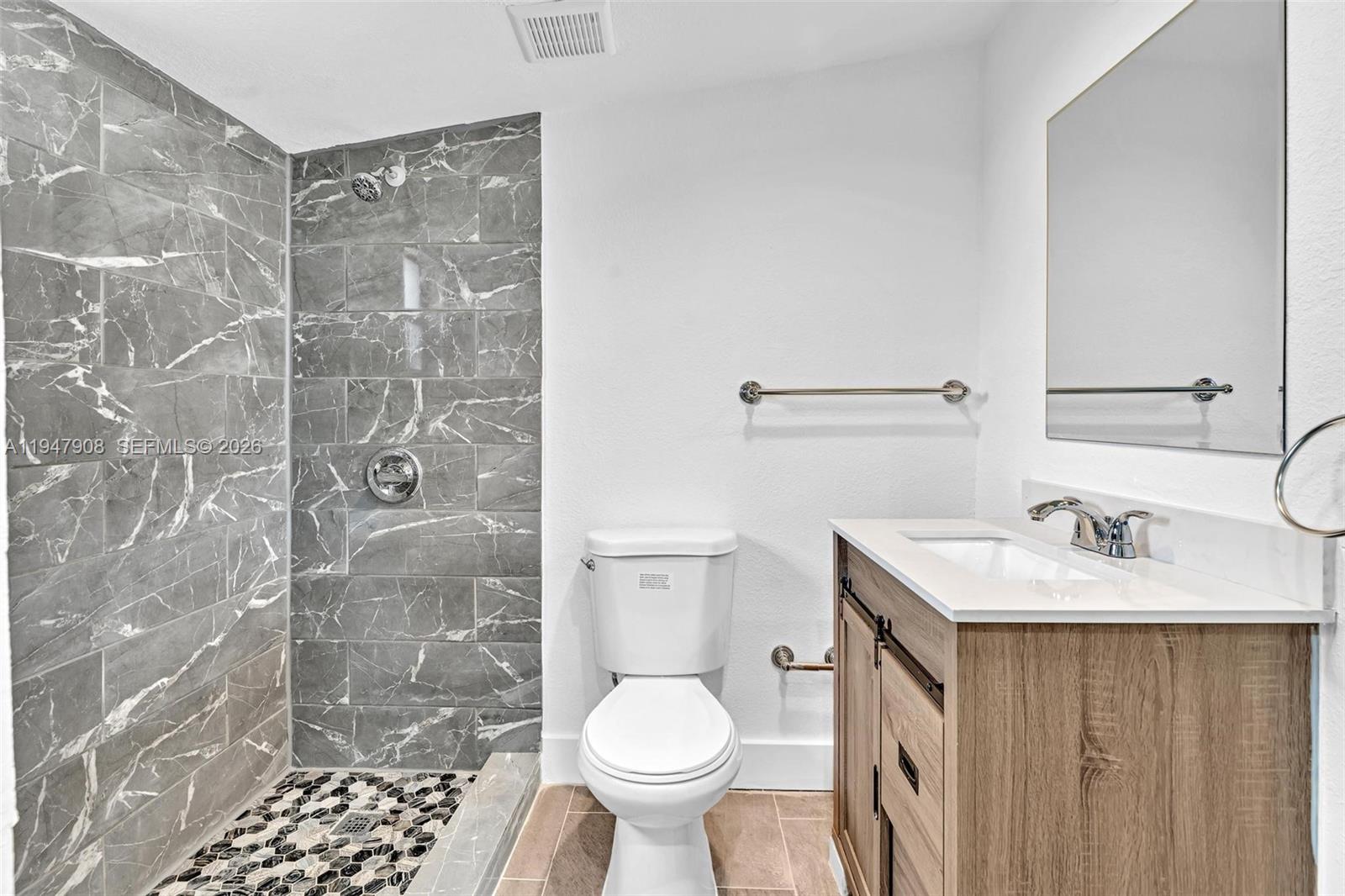 2636 Southwest 29th Court Miami, FL 33133 - Photo 30 of 33 a bathroom with a sink toilet and shower