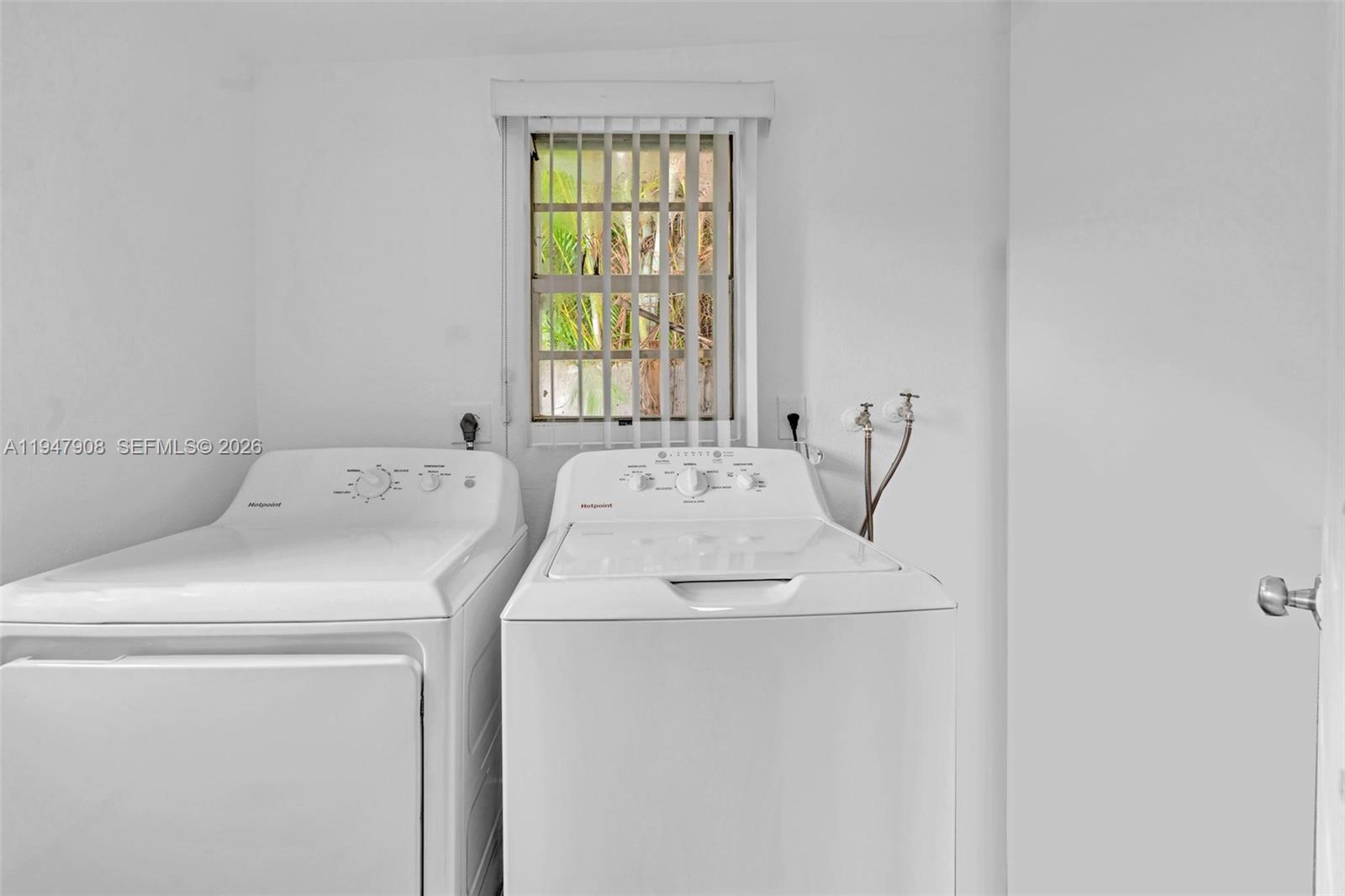 2636 Southwest 29th Court Miami, FL 33133 - Photo 32 of 33 a utility room with dryer and washer