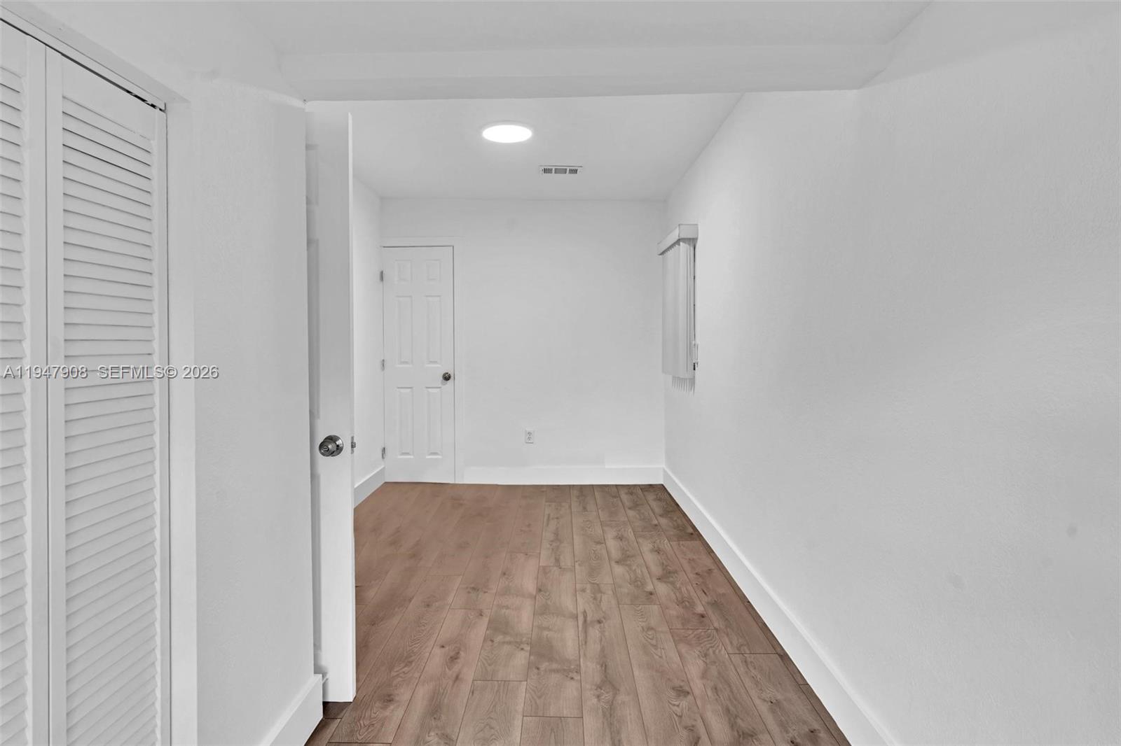2636 Southwest 29th Court Miami, FL 33133 - Photo 8 of 33 a view of a room with wooden floor