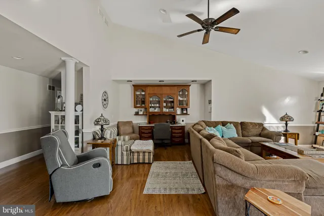 a view of swimming pool with sitting area and garden