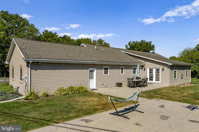 an aerial view of a house with garden space and street view