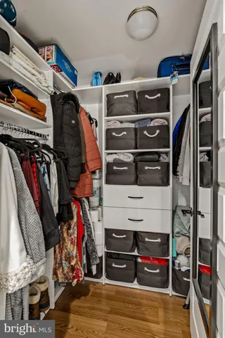 a bathroom with a double vanity sink toilet mirror and shower