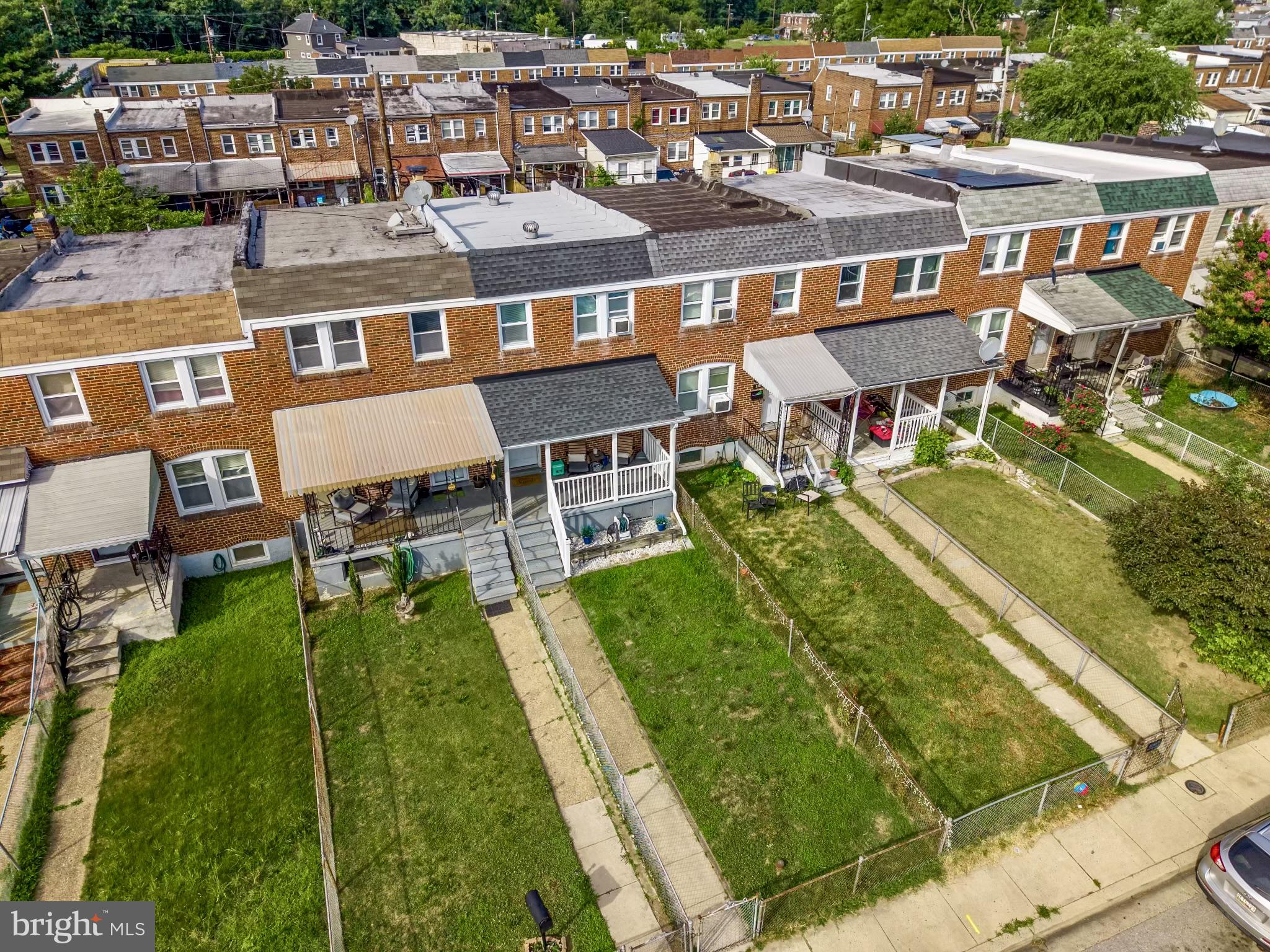 234 West Edgevale Road Baltimore, MD 21225 - Photo 30 of 45 Charming row homes with green lawns.