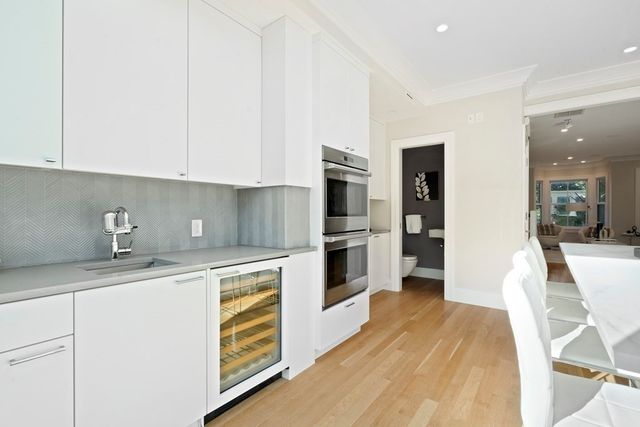 a kitchen with stainless steel appliances granite countertop a refrigerator sink and cabinets