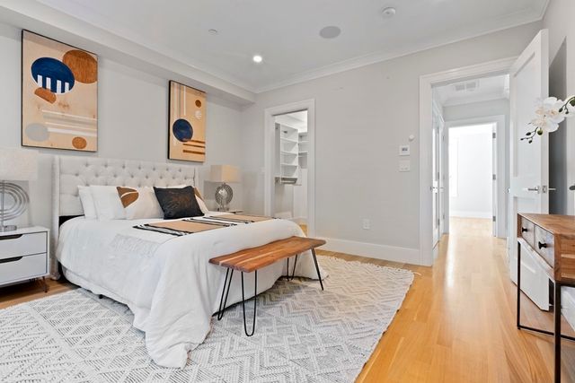 a bedroom with a bed and a table