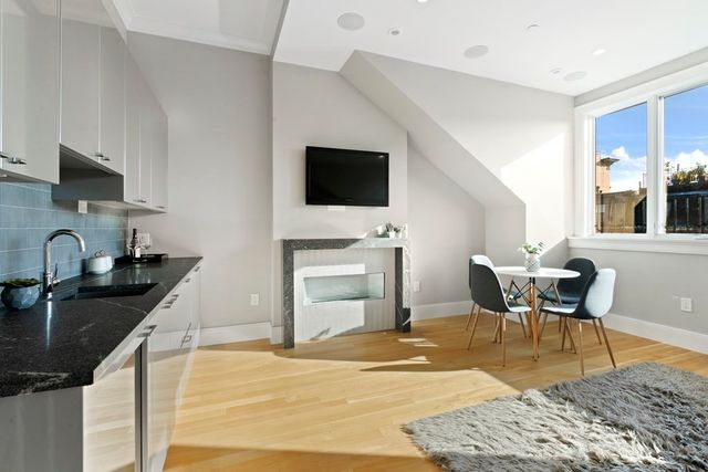 a kitchen with granite countertop sink dining table and chairs