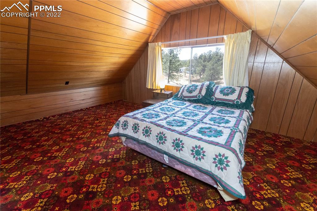 442 Due S Road Florissant, CO 80816 - Photo 11 of 43 a bed sitting in a bedroom next to a window