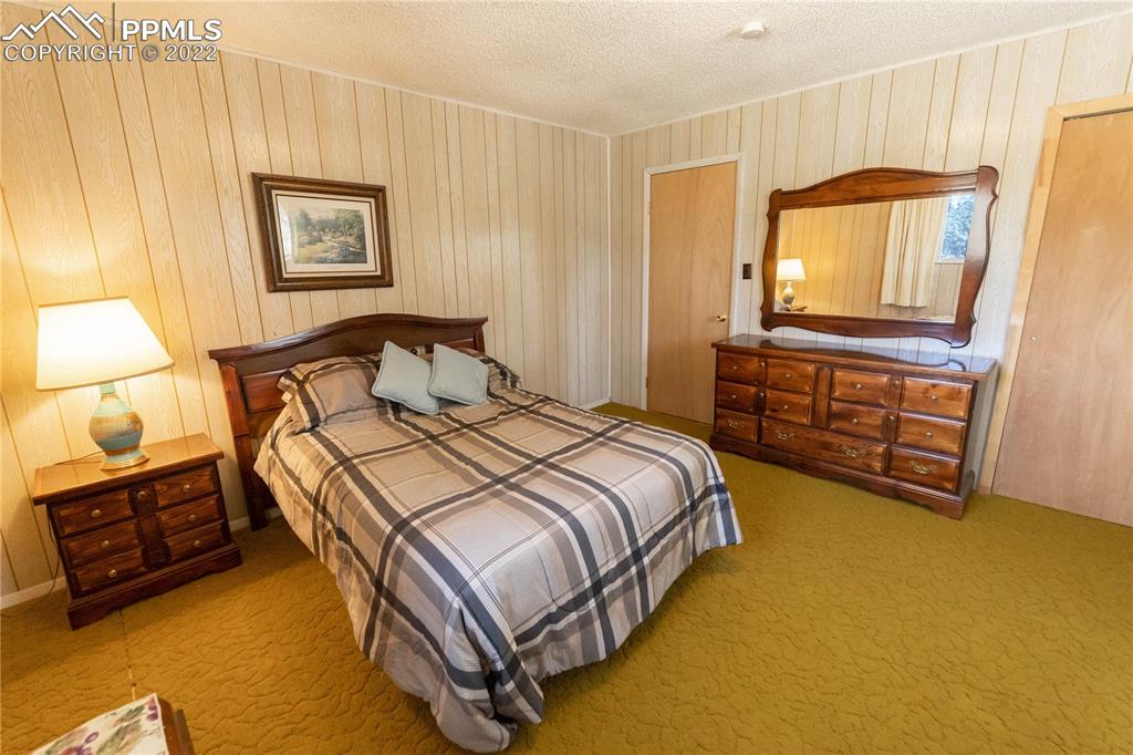 442 Due S Road Florissant, CO 80816 - Photo 16 of 43 a bedroom with a bed and a cabinets