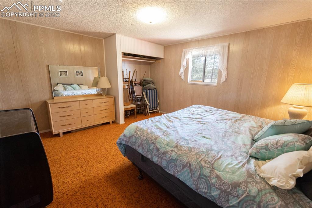 442 Due S Road Florissant, CO 80816 - Photo 20 of 43 a bedroom with a bed and window