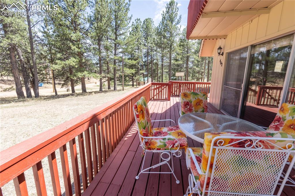 442 Due S Road Florissant, CO 80816 - Photo 3 of 43 a balcony with wooden floor and outdoor seating