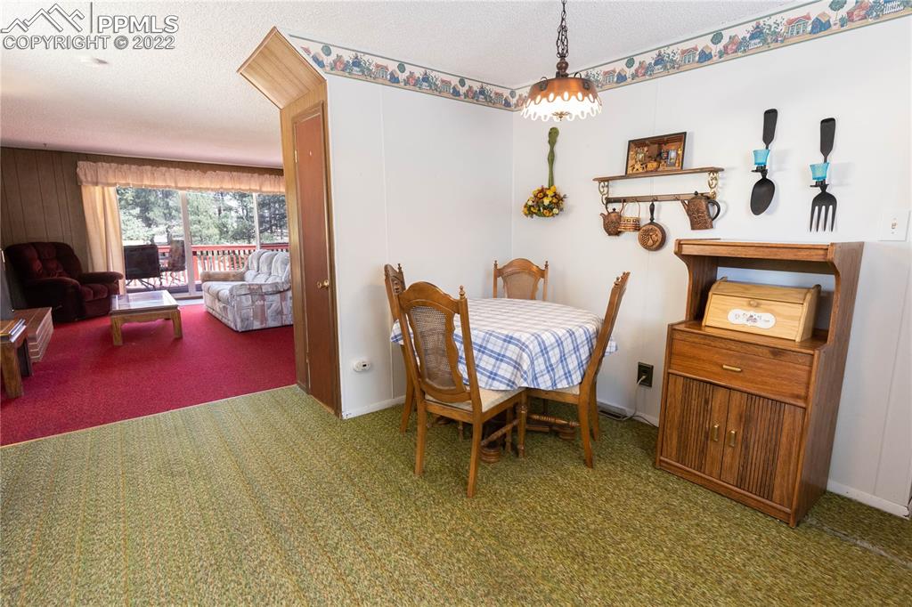 442 Due S Road Florissant, CO 80816 - Photo 32 of 43 a dining room with furniture and window
