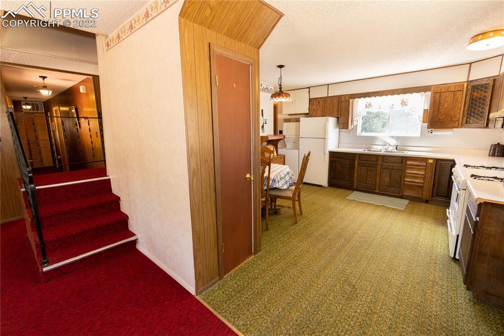 442 Due S Road Florissant, CO 80816 - Photo 35 of 43 a view of a hallway with furniture and natural light