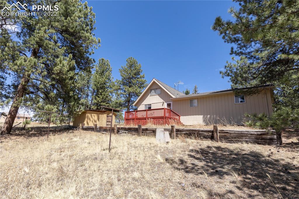 442 Due S Road Florissant, CO 80816 - Photo 37 of 43 a backyard of a house with table and chairs